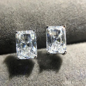 Macro detail of radiant cut square zircon stud earrings with classic four-prong setting