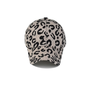 Detail of leopard print baseball cap featuring high-quality knit texture and curved brim