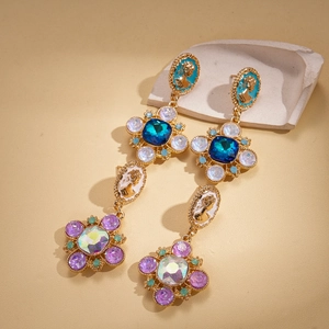 Bohemian vintage gold drop earrings with colorful gemstones and floral portrait relief