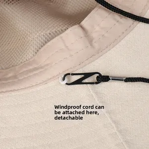 Close-up of the beige sun hat featuring a breathable mesh lining and windproof rope clip