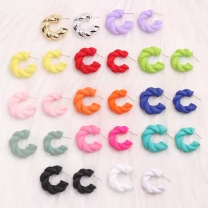 Chunky twisted C-shaped acrylic hoop earrings in various vibrant colors and metallic finishes