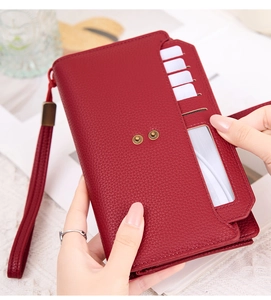 Detail of dark red RFID purse showing lychee texture, card slots, and wrist strap