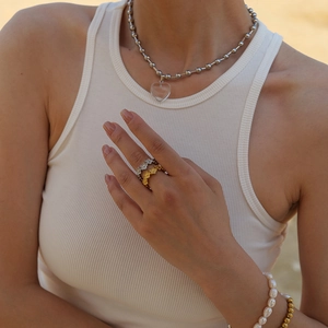 Chic C-shaped stainless steel flower rings in gold and silver finish on a female model