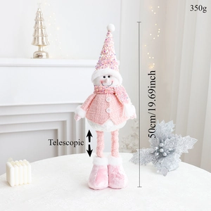 Pink Christmas snowman doll with telescopic legs displayed in a cozy holiday setting