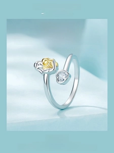 Detail of 925 sterling silver ring showing a mother and daughter hug with a heart stone