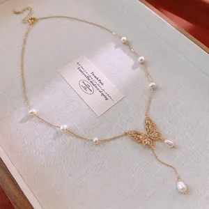 Gold plated butterfly necklace with sparkling zircon stones and elegant freshwater pearls