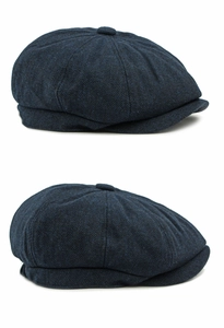 Detail view of the navy blue herringbone pattern on a retro wool blend newsboy cap