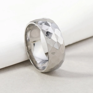 Men's 8mm silver titanium steel ring with geometric faceted texture and polished finish