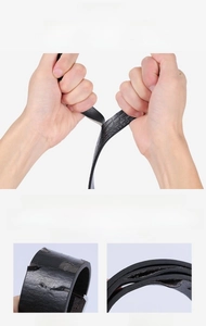 Detail of durable black crocodile pattern leather belt showing high flexibility and strength