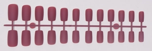 Detailed row of matte dark red long square press-on nails on a single plastic frame