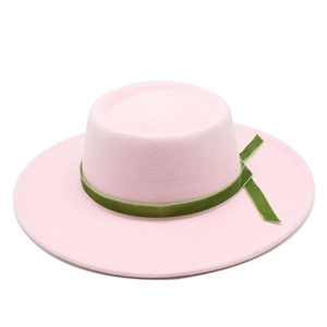 Detail of pink wool felt boater hat featuring a dark green velvet decorative ribbon band