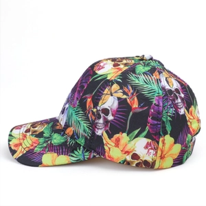 Side view detail of baseball cap with colorful skull and tropical floral leaf print