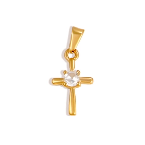 Macro detail of 24K gold plated cross pendant with a brilliant round white zircon stone