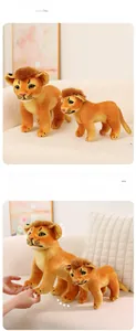 Detail view of two stuffed lion plush toys in 26cm and 36cm sizes on a sofa