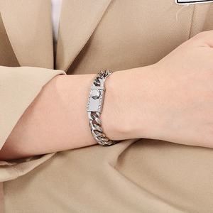 Close-up of 10mm polished silver Miami Cuban link bracelet with cylindrical clasp