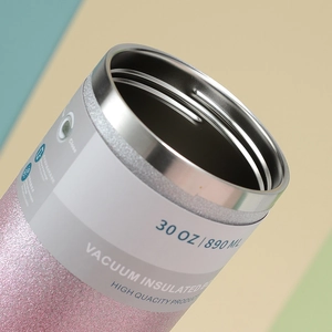 Detail view of pink diamond texture 30oz tumbler with stainless steel rim and label