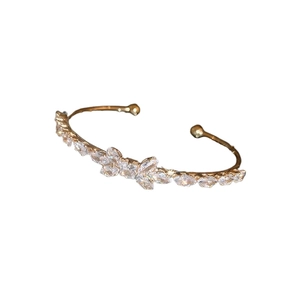 Luxury gold bow knot cuff bracelet with pavé cubic zirconia for an elegant women's look