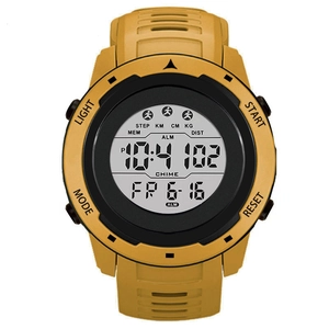Detail view of yellow digital sports watch with pedometer, alarm and luminous display