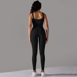 Detail of racerback design on ribbed black seamless yoga jumpsuit from back view