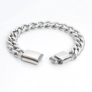 Sleek silver stainless steel Cuban link bracelet with magnetic clasp on white background