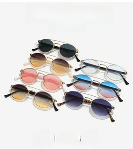 Detailed collection of vintage double-bridge oval sunglasses with metallic gold frames