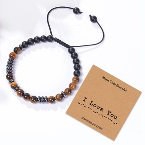 Morse code bracelet with tiger eye beads and black stones on an I Love You card
