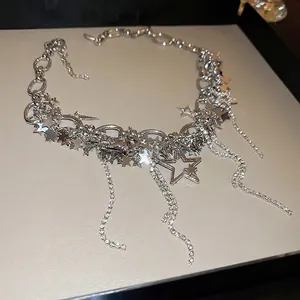 Silver star tassel necklace with hollow pendants and sparkling rhinestones fringe