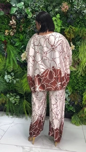 Detail of silk texture floral print wide-leg pants and loose top set from the back