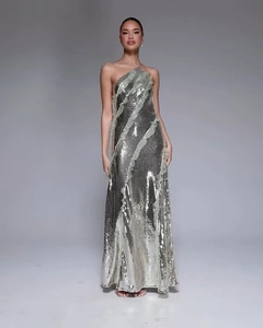 Detail of silver sequined evening gown featuring elegant ruffled mesh asymmetrical trim