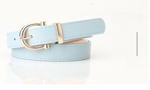 Detail of light blue PU leather belt for women with a gold horseshoe buckle and stitching