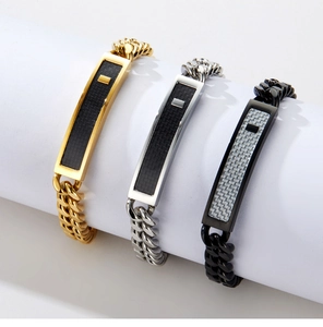 Three Cuban link bracelets in gold, silver and black with carbon fiber inserts detail