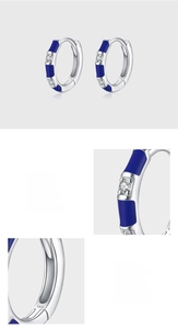 Detailed macro view of S925 sterling silver earrings with blue enamel and zircon inlay