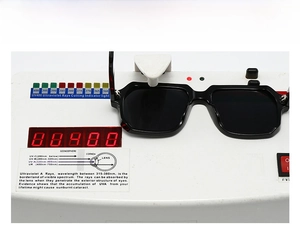 UV400 test showing black square sunglasses blocking harmful ultraviolet rays on a device