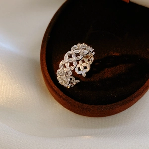 Macro detail of 18k gold plated silver mesh ring with pave-set clear zircon stones