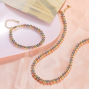 Three-tone beaded necklace and bracelet set in gold, silver, and rose gold finishes