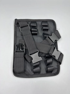 Detail of black tactical tool belt with MOLLE webbing loops and heavy duty buckles