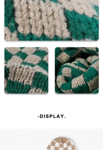 Close-up of thick checkered knit fabric and pattern detail on the winter beanie