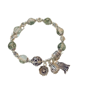 Vintage green beads bracelet with silver pendants and traditional lucky fortune charms