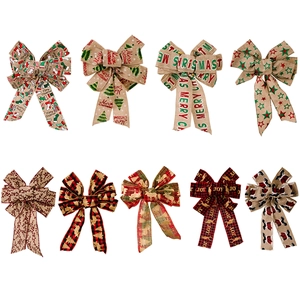 Nine assorted rustic Christmas burlap bows with Merry Christmas and Joy printing