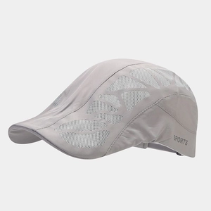 Detail view of breathable grey sport beret mesh fabric with sports print text