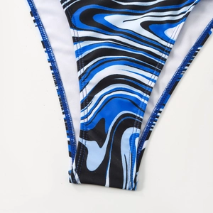 Macro detail of striped marble pattern bikini bottom with precise stitching and white lining