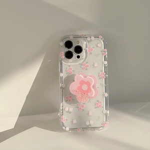 Clear iPhone case with floral patterns and a pink flower-shaped pop socket stand