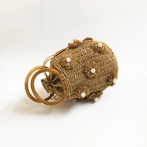 Handmade straw bucket bag with faux pearl flower decor and circular wooden handles