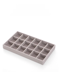 Detail of gray velvet jewelry box with 24 compartments for rings and earrings