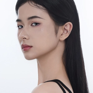 Minimalist S925 sterling silver triple layer spiral ear cuff shown on model's ear