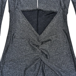 Detail of silver metallic fabric with back cutout and twist knot design for jumpsuit