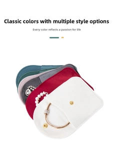 Macro detail of velvet jewelry pouches in multiple colors with gold snap buttons