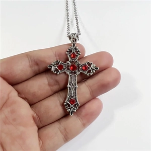 Gothic silver cross pendant necklace with five red gemstones on a thin chain