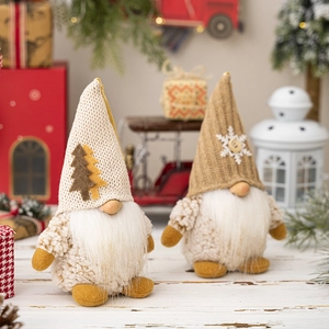 Detail of Christmas gnomes with knitted hats and white beards on a festive tabletop
