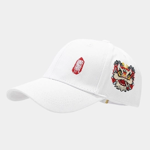 Detail of red Chinese seal script and colorful lion dance embroidery on white baseball cap